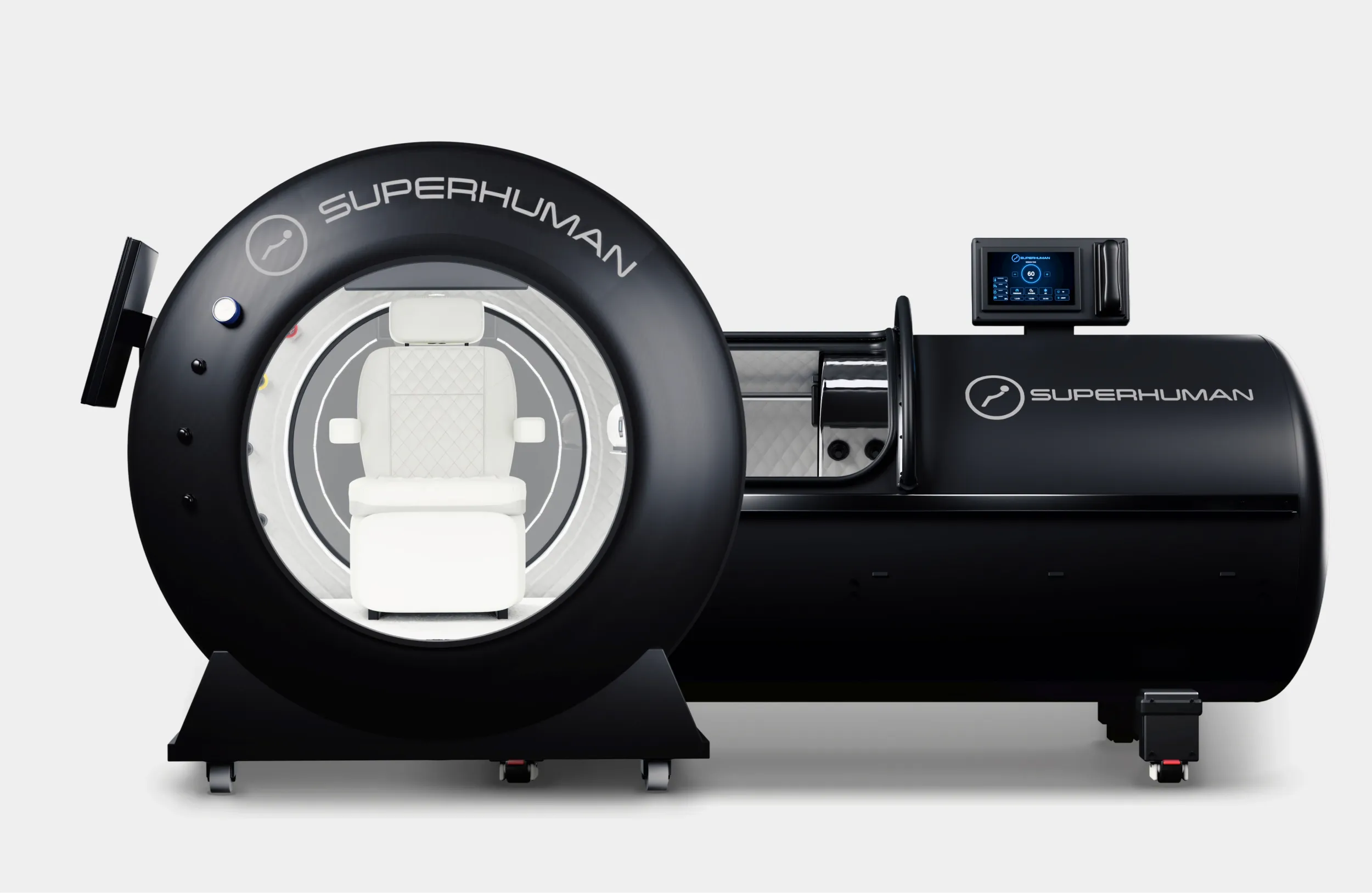 Superhuman X seated hard-shell hyperbaric chamber beside the L1 lying hard-shell chamber