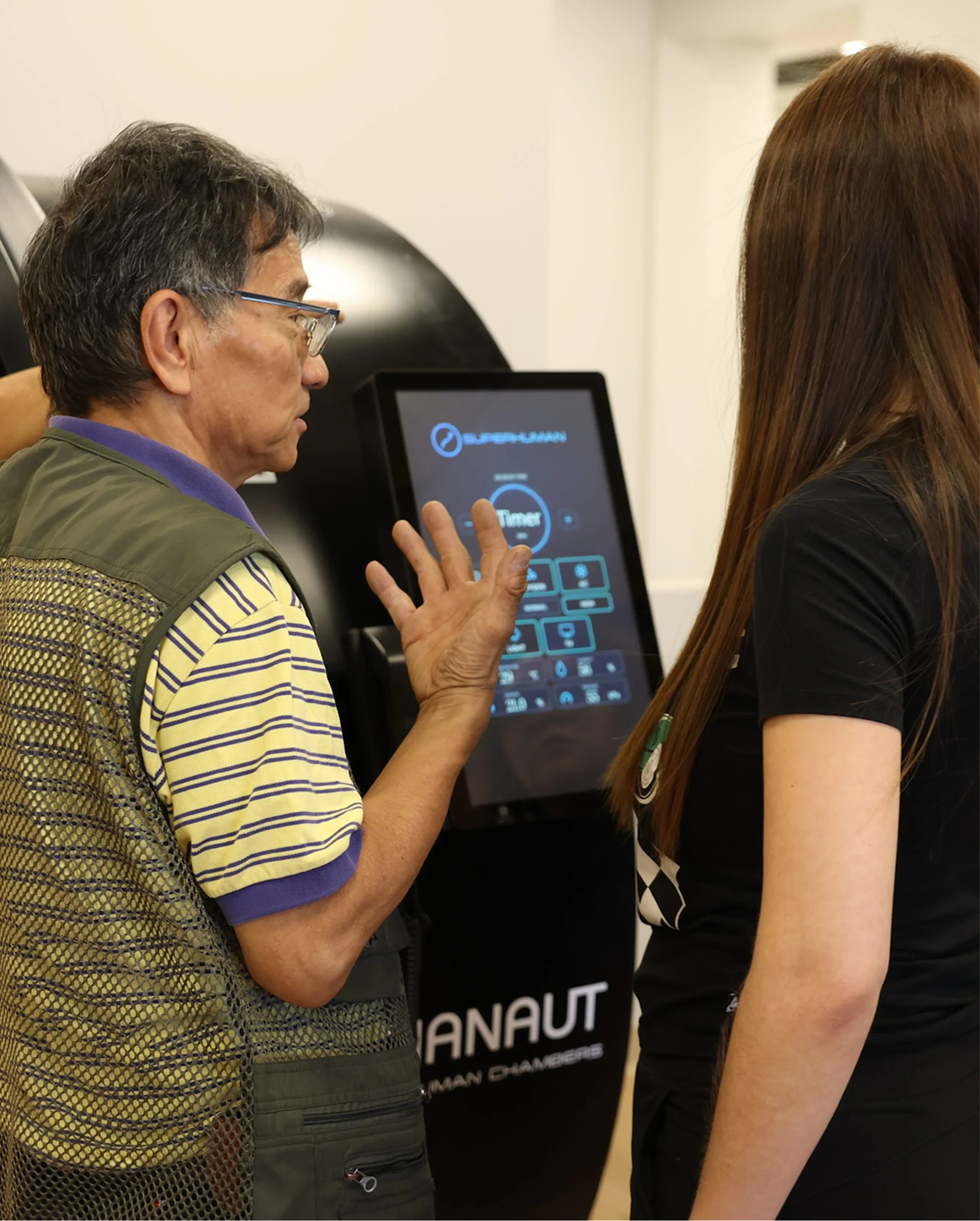 A client talking through the chamber control screen with a Superhuman team member