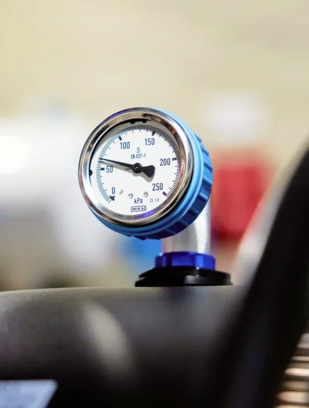 The pressure gauge on a Superhuman chamber, close up
