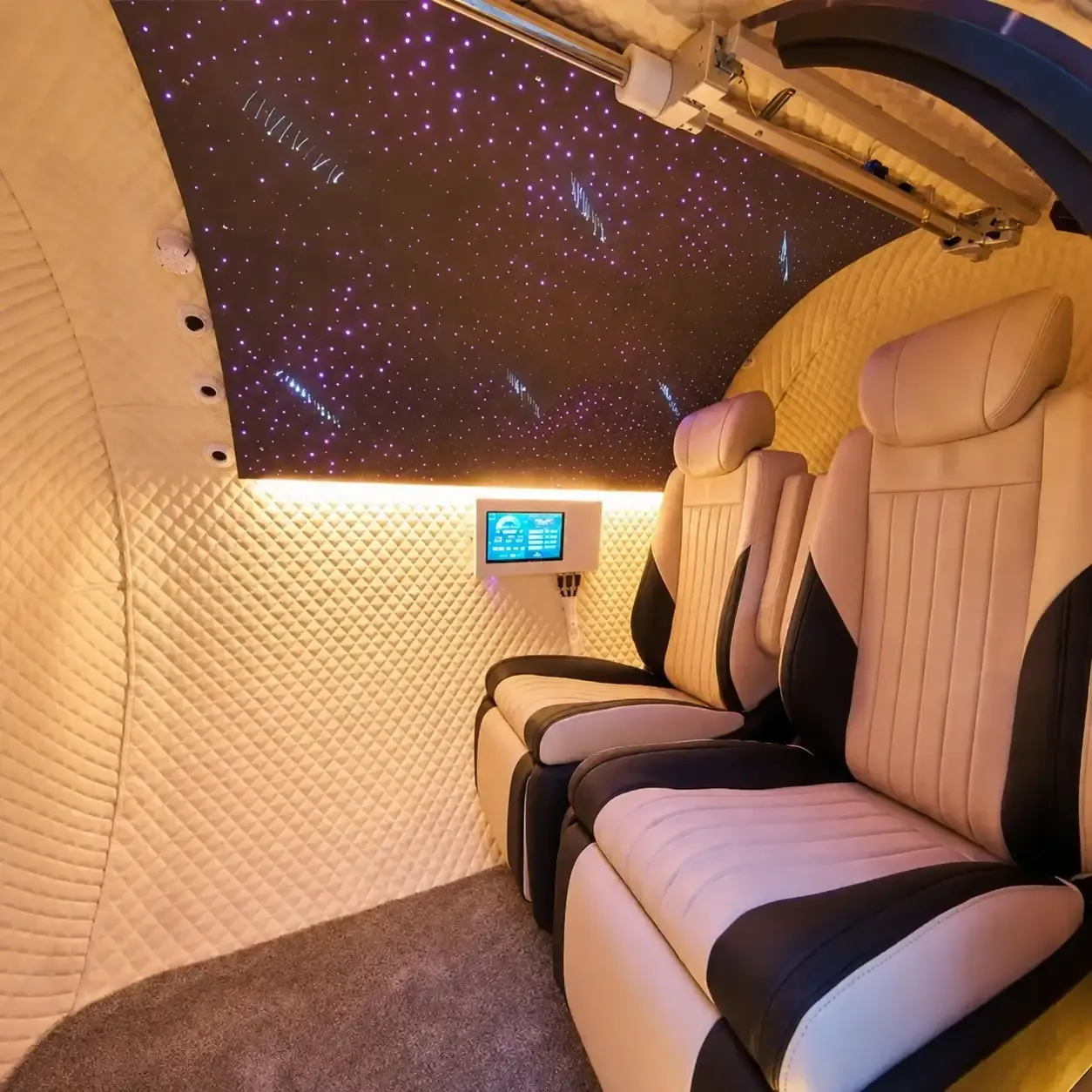T2 interior with fibre-optic star ceiling and two reclined seats